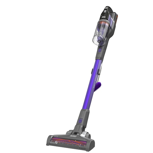 A BLACK+DECKER cordless stick vacuum cleaner in grey and purple. The vacuum features a transparent dust container and a slim, modern design.
