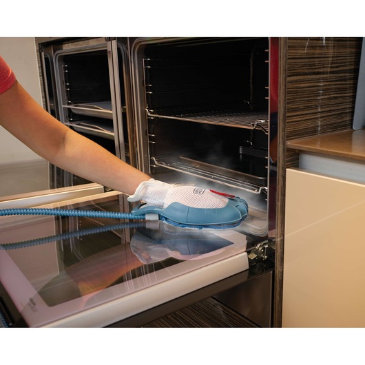 BLACKDECKER FSMH13101SM steam cleaning glove used to clean oven door.