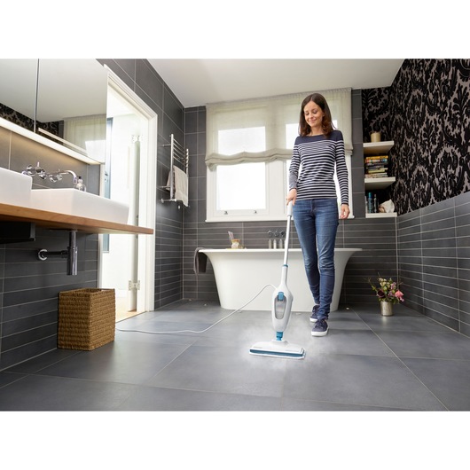 BLACKDECKER FSMH13E10 steam mop in use cleaning bathroom tile floor.