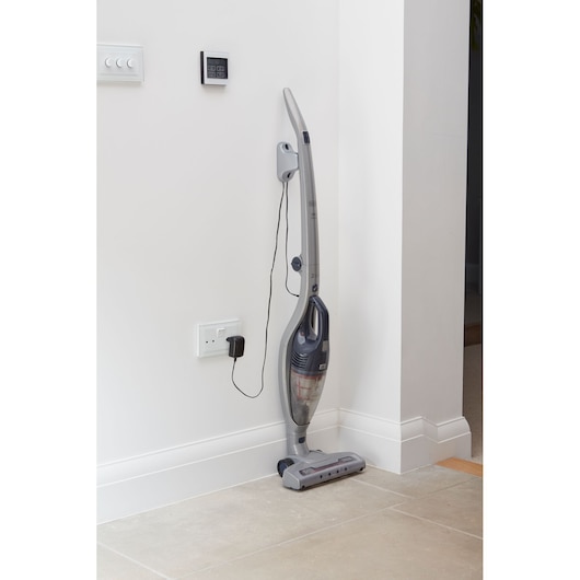 BLACKDECKER SVB520JW cordless stick vacuum cleaner in silver and grey on white wall, front angle.